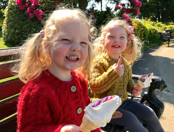 Enjoying the bank holiday sunshine are Lydia and Fearn with their ice creams.