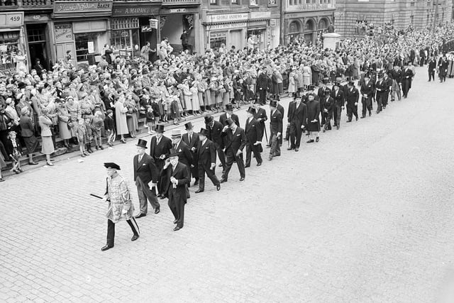 A third procession marking the opening of the Edinburgh Festival, lapped up by cheering crowds. This one dates back to 1952.