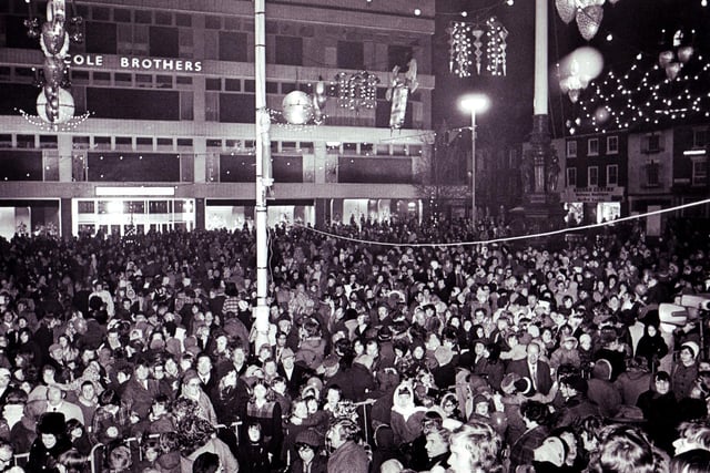 The crowds flock to the switch on of the Christmas illuminations in Barker's Pool in 1974