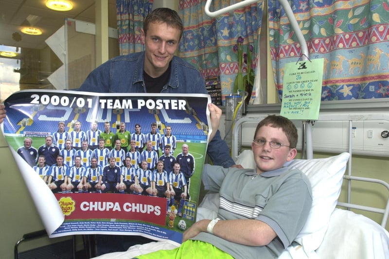 Pictured at the Sheffield Children's Hospital in March 2001, where Sheff Wednesday player Ian Hendon is seen preseting a team poster to fan Joseph Twelvetrees 14 who had his legs broken in farm machinery back