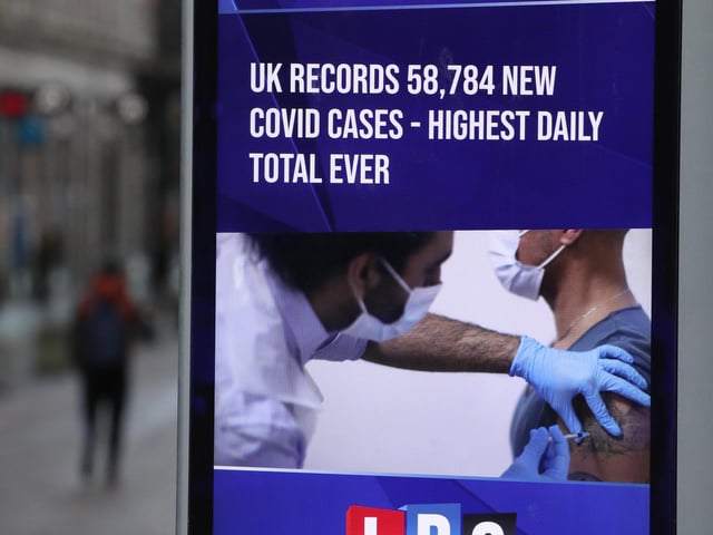 A coronavirus sign in Glasgow, the morning after stricter lockdown measures came into force