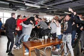 Simon Bellis, Sheffield United's official club photographer, says this is his favouite picture from Sheffield United's promotion winning party, which took place at Bramall Lane a year ago tomorrow: Simon Bellis/Sportimage