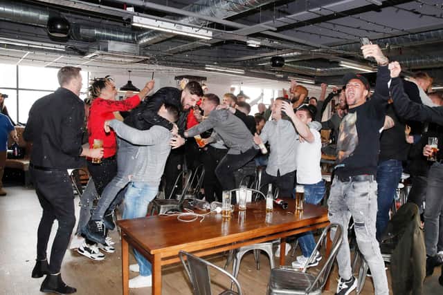 Simon Bellis, Sheffield United's official club photographer, says this is his favouite picture from Sheffield United's promotion winning party, which took place at Bramall Lane a year ago tomorrow: Simon Bellis/Sportimage