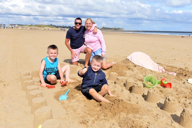 Family Lisa and David Quigley enjoyed a day building sandcastles with sons Harry, seven and Jack, five.