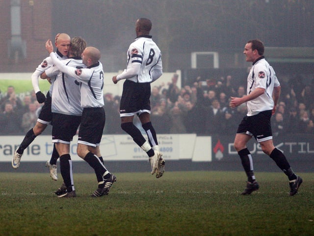 Meikle is congratulated by his team-mates.