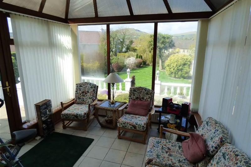 Conservatory with views of rear garden.