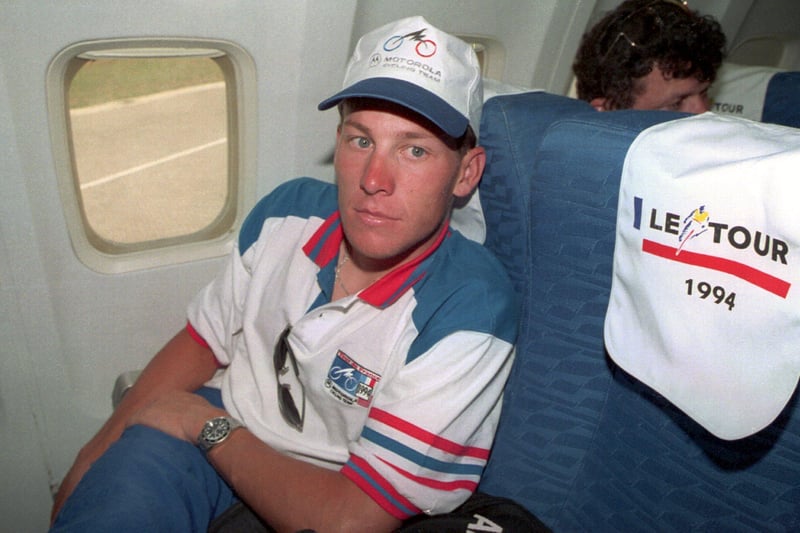 Lance Armstong relaxes in his seat on the plane taking the rides from Portsmouth to Cherbourg after Stage 5 of the Tour de France in 1994. Picture: Pascal Rondeau/ALLSPORT/ Getty Images