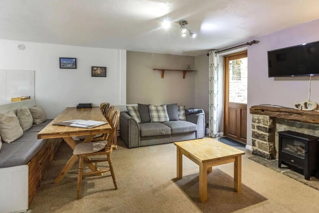 The homely living room will provide a perfect place to relax after a long walk in the Peaks.