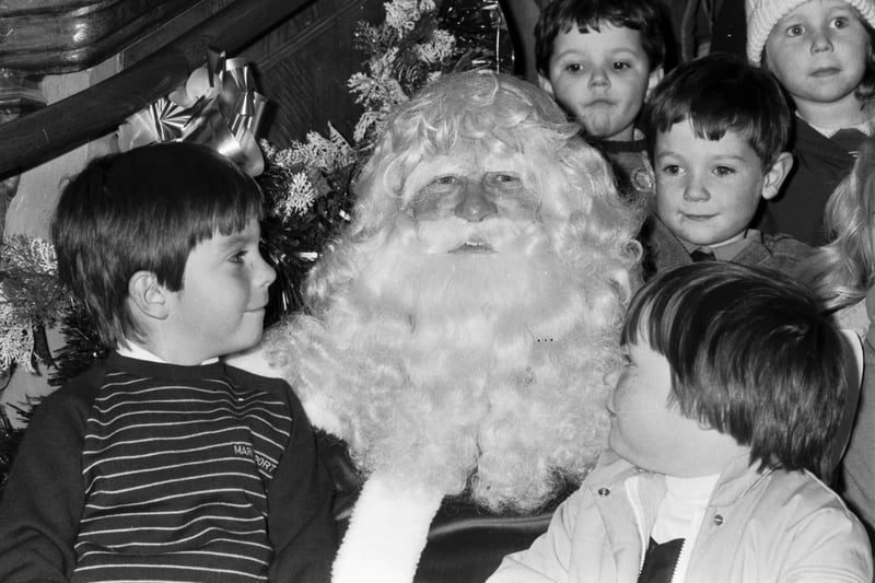 Santa Claus meets some children when he arrives at Jenners department store in Edinburgh in November 1984