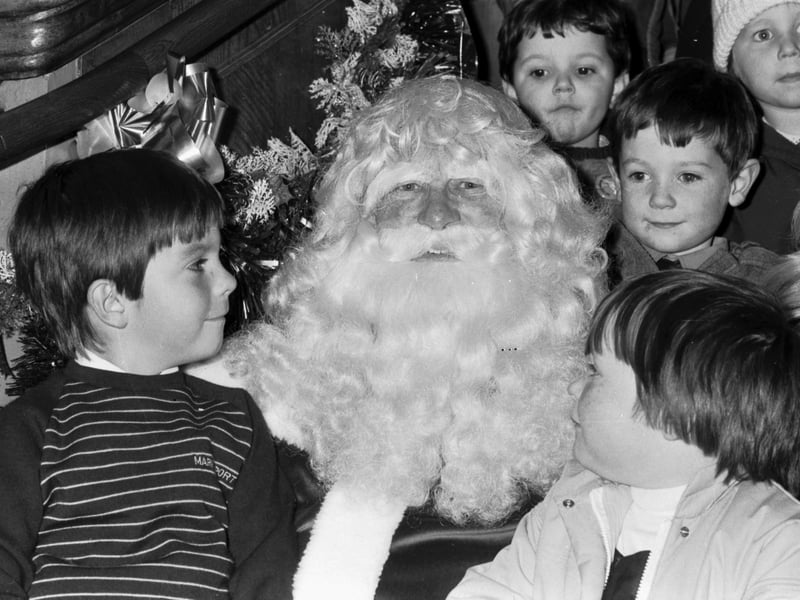 Santa Claus meets some children when he arrives at Jenners department store in Edinburgh in November 1984