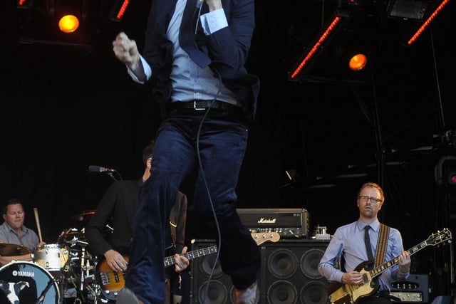 Jarvis Cocker of Pulp launching himself into the air at Glastonbury 2011