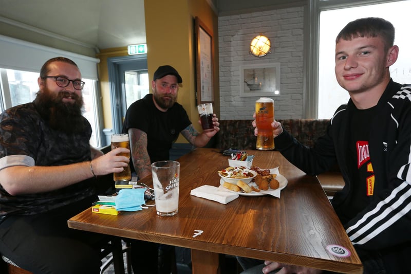 From left, Sam Beckett, James Smith and Tyler Braddock. Fans watch England v Czech Reublic in England's third Group D game of Euro 2020, in The Star & Garter pub, Copnor, Portsmouth. Picture: Chris Moorhouse (jpns 220621-13)