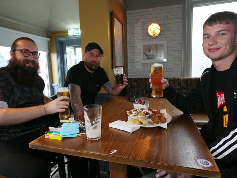 From left, Sam Beckett, James Smith and Tyler Braddock. Fans watch England v Czech Reublic in England's third Group D game of Euro 2020, in The Star & Garter pub, Copnor, Portsmouth. Picture: Chris Moorhouse (jpns 220621-13)