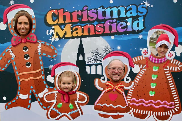 Poking their heads through this 'Christmas In Mansfield' display are a family very much in the festive mood.