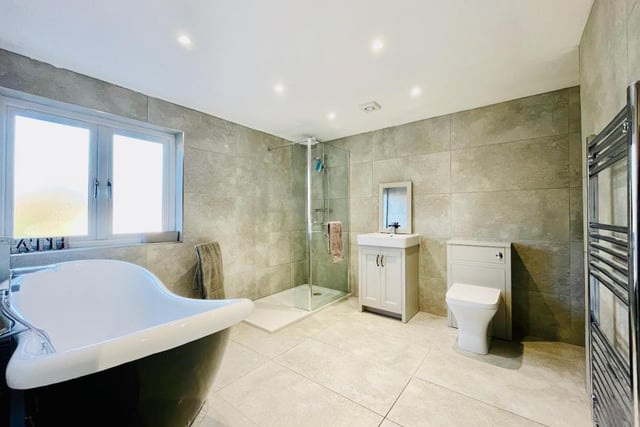 This en-suite bathroom is light and bright, with plenty of space.