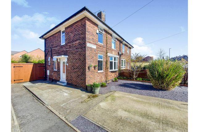 The semi-detached home has a driveway to the front and side access to the huge rear garden.