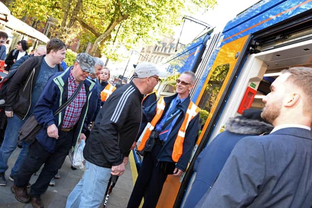 Members of the public rush to board the Train Tram at Cathedral tram stop at its launch in October 2018. Picture: Marie Caley NSST-25-10-18-TraTrain-4