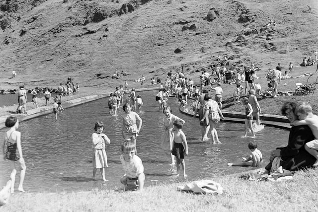 Another picture of children in the now demolished paddling pool beside St Margaret's Loch in July 1955.