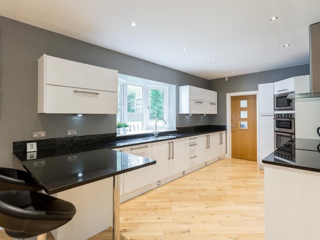 The kitchen leads to a utility room.