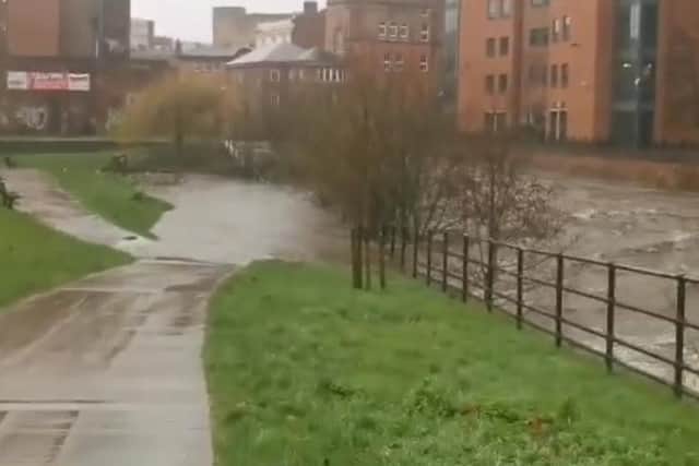 The River Don, running alongside Nursery Street and Riverside, in Sheffield city centre, has breached its banks