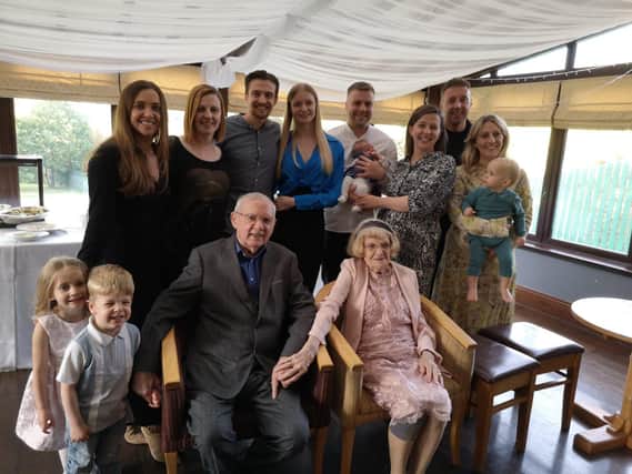 Ernest, his wife Jean, five grandchildren and partners, and four great-grandchildren.