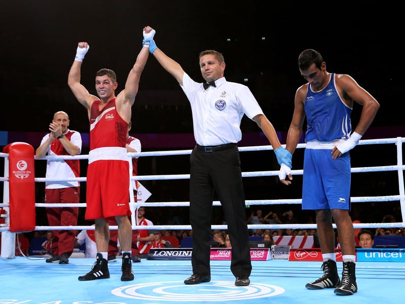 Scott Fitzgerald of England celebrates winning the gold medal against Mandeep Jangra of India in the Men's Welter (69kg) Final at SSE Hydro during day ten of the Glasgow 2014 Commonwealth Games .