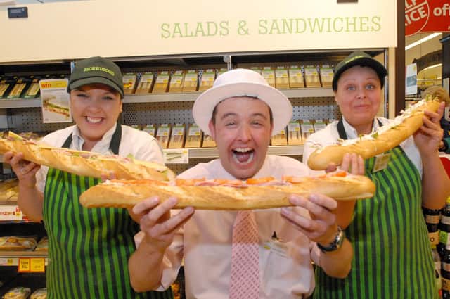 Sean Chapman gets stuck in to a treat at Morrisons during the 2009 British Sandwick Week with Emma Grey and Tracey Archibald joining in.