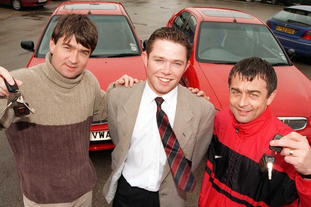 Dixon Rover sales executive James Kitching handed over the keys of the two sponsored cars to Doncaster Rovers FC managerial duo, boss Ian Snodin (left) and his brother and number two, Glynn Snodin in 1999