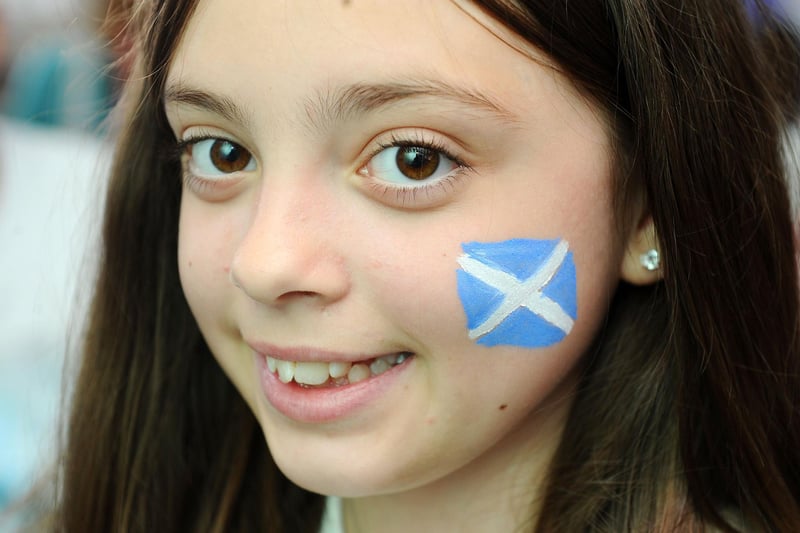 A smile and a saltire ass this youngster supports Scotland on their return to the big stage after 23 years.
(Pic: Michael Gillen)
