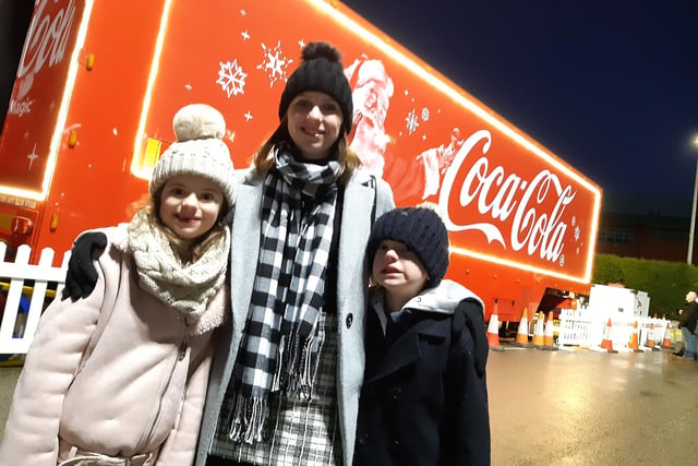 Hundreds of families headed for the bright red Coca Cola Truck as it finally arrived at Meadowhall this evening. Catherine Edgar with Lucy and Olly