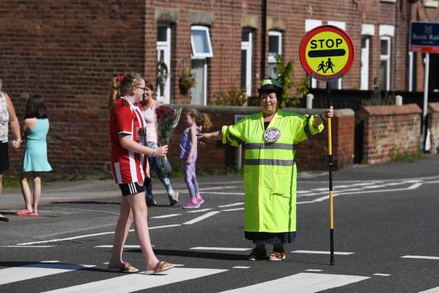 Treeton Lollypop lady, Glynnis Bolton, who has done the job for 20 years. Celebrates her 65th today.
Picture Jonathan Gawthorpe
24th April 2020.