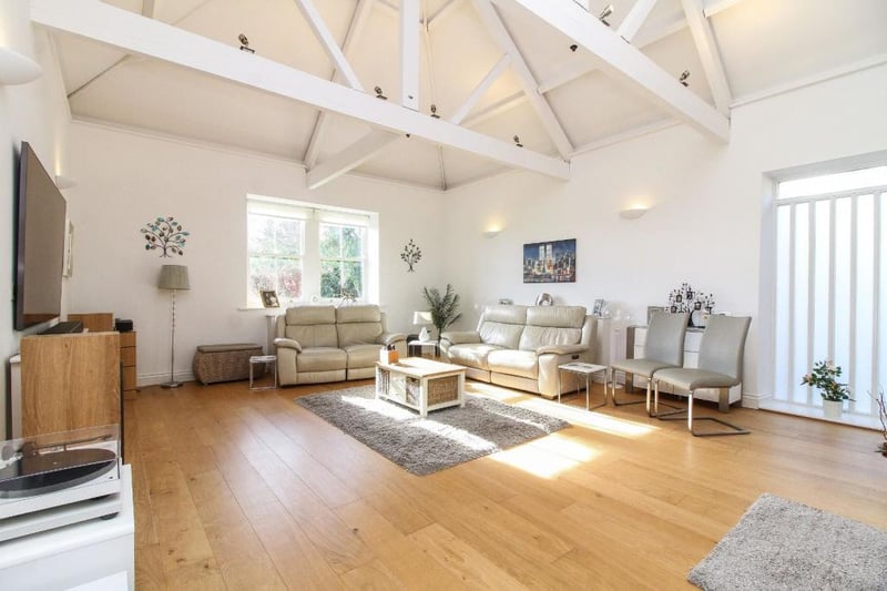 The lounge impresses with its vaulted ceilings and meadow views.
