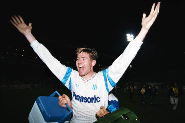 Chris Waddle celebrates after his goal for Marseille beat AC Milan to win the UEFA European Cup quarter final second leg match in March 1991. (Photo by Simon Bruty/Getty Images)