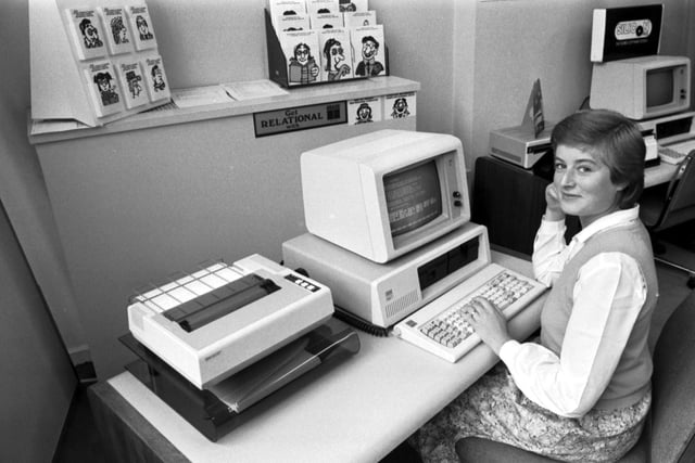 A girl using the new IBM personal computer (with dot matrix printer) at the Micro Centre in Dundee Street Edinburgh, September 1983.