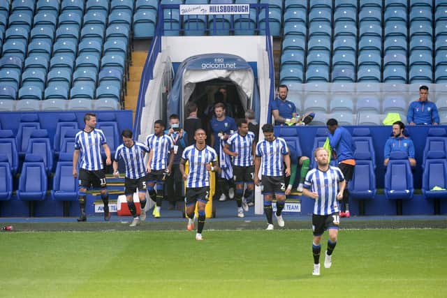 Sheffield Wednesday are led out onto the pitch by skipper Barry Bannan. Pic Steve Ellis