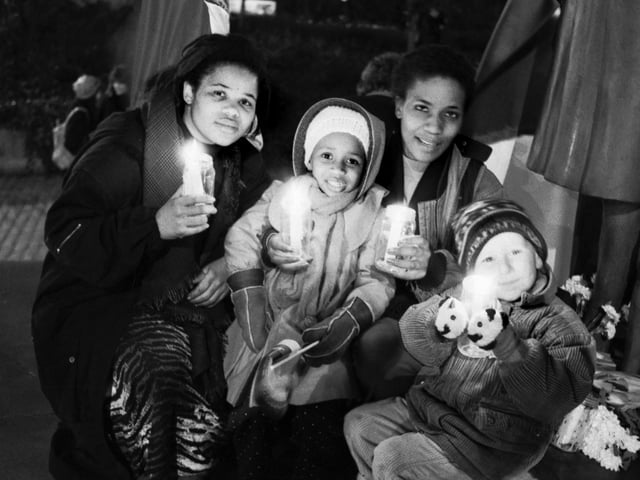 Lorata Lamola, Zandile Mthethwa, Pat Lobelo and Stephen Penman join a candle-lit vigil at Festival Square in Edinburgh to celebrate the release of the ANC's Nelson Mandela in February 1990.