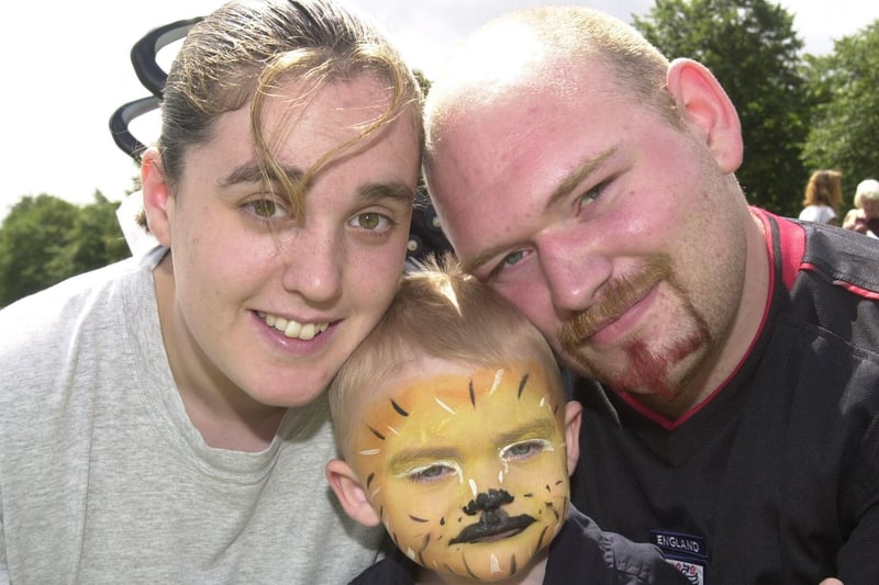 Chris and Caroline Sayles are seen with their tiger face painted son Declan age two back in 2003