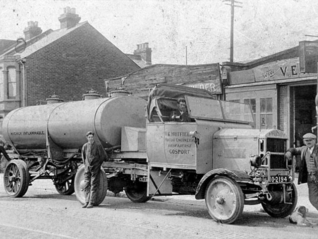 Vic Hutfield, at the front, with coach he modified into a fuel tanker. Photos was taken in 1925 outside his garage which is now Reekies, in Brockhurst Road, Gosport. Picture: Courtesy Brenda Gilbert