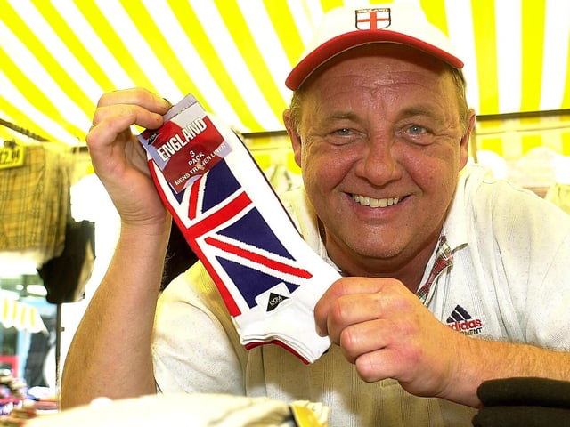 2004. City market trader Tony Hull, selling England socks from his stall in Commercial Road, Portsmouth. Picture: Ian Hargreaves (042988-1)