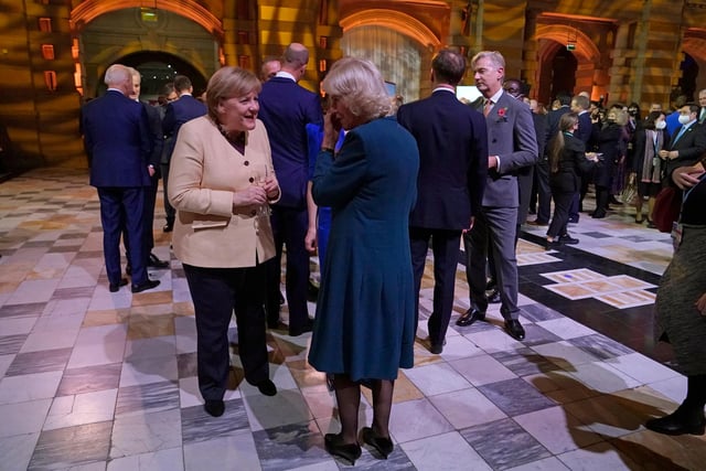 German Chancellor Angela Merkel, left, speaks to Camilla, Duchess of Cornwall.