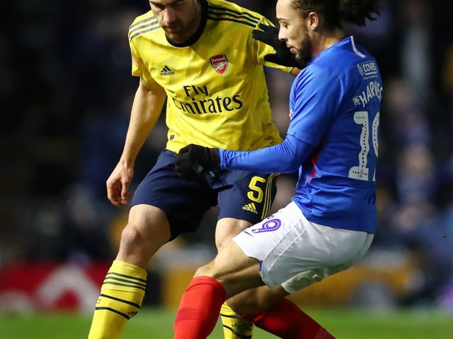 Marcus Harness competes with Sokratis Papastathopoulos for the ball in the first half.