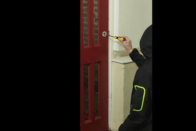 Scarlot sent The Star a video of her partner trying to force the broken door open with a screwdriver just so she could leave the flat.