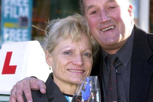 Driving instructor Mel Rodgers (50) and his wife, Janet (49) celebrate winning £119,075 outside GT News in Hartley Brook Road, Shiregreen, Sheffield on January 22, 2002