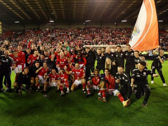 BARNSLEY, ENGLAND - MAY 19: The Barnsley team celebrate victory following the Sky Bet League One Play-Off Semi-Final Second Leg match between Barnsley and Bolton Wanderers at Oakwell Stadium on May 19, 2023 in Barnsley, England. (Photo by George Wood/Getty Images)