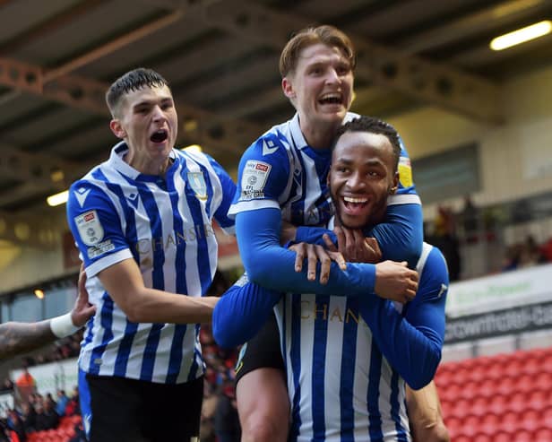 Saido Berahino celebrates his second Sheffield Wednesday goal with in-form pair George Byers and Jordan Storey.