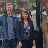 Paul Turpin and Marieanne Elliott standing under a 20mph sign in Heeley, Sheffield