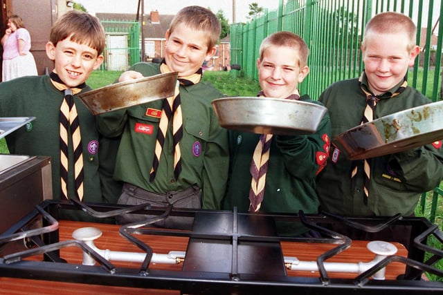 The 32nd (Armthorpe) Doncaster Scout Group scouts, from left, Graham Pratt, aged nine, Christopher Stretton, aged 11, Lee Colclough, aged nine, and Michael Colclough, aged 11, try out the new cooking stove and bain-marie in 1998