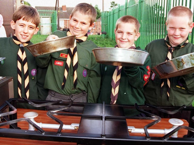 The 32nd (Armthorpe) Doncaster Scout Group scouts, from left, Graham Pratt, aged nine, Christopher Stretton, aged 11, Lee Colclough, aged nine, and Michael Colclough, aged 11, try out the new cooking stove and bain-marie in 1998