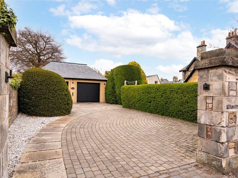 Driveway leading to double garage.