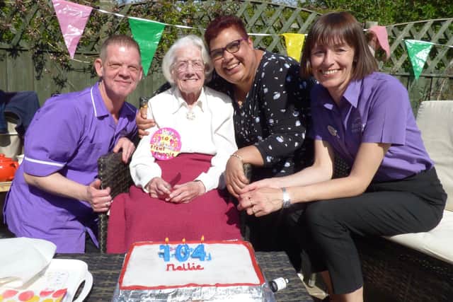 Nellie Alker with the Grange Crescent team on her 104th birthday.